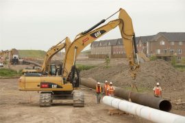 Aecon crews working on the Milton replacement Phase 2B, which involves the installation of approximately 1,500 metres of 26-in. steel and 1,500m of 34-in. steel gas main in Milton. Ont. Aecon, in a joint venture, was recently awarded a $600-million contract for the installation of 560 kilometres of underground pipeline running from Edmonton, Alta. to Fort McMurray, Alta. Photo courtesy of Aecon Group Inc.