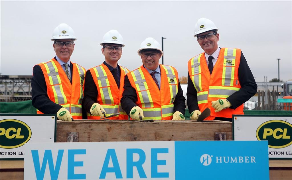 Jim Dougan, PCL Construction President, Tim Brilhante, Humber Students' Federation President, Brad Duguid, Minister of Training, Colleges and Universities and Chris Whitaker, Humber College President together during the official groundbreaking ceremony on Oct. 4, 2013. (CNW Group/Infrastructure Ontario)