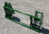 Attachment adapter for John Deere loaders