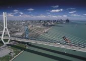 The Windsor Detroit Bridge project includes a six-lane bridge, providing three Canada-bound lanes and three US-bound lanes over the Detroit River. Two bridge types were considered under the DRIC study - cable stayed and suspension. The bridge will have a clear span of 850 metres/2788 feet across the Detroit River with no piers in the water.