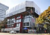 Upbrella Construction is using a unique system that sees the roof of a 10-storey condominium project being built first.