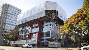 Upbrella Construction is using a unique system that sees the roof of a 10-storey condominium project being built first.