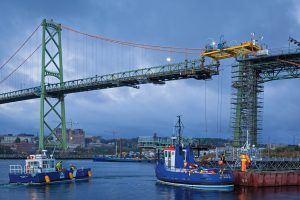 Service vessels transport staff to the barge during morning crew change.