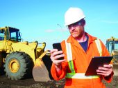 Construction Worker and Computer and Phone Technology