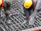 Workers pouring concrete