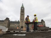 Excavation of front lawn and paving stones of Centre Block.