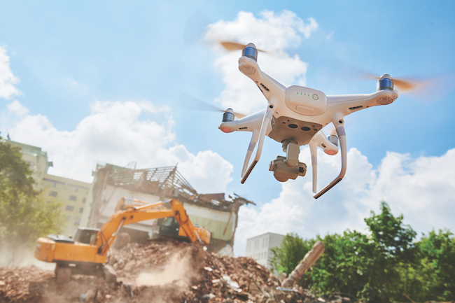 Drone inspecting construction demolition site or building area