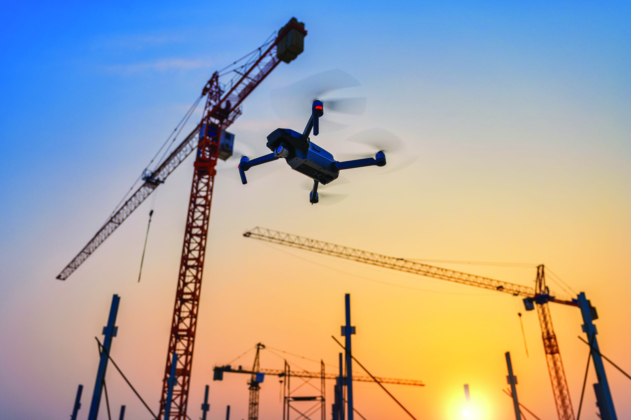 Drone over construction site. video surveillance or industrial i