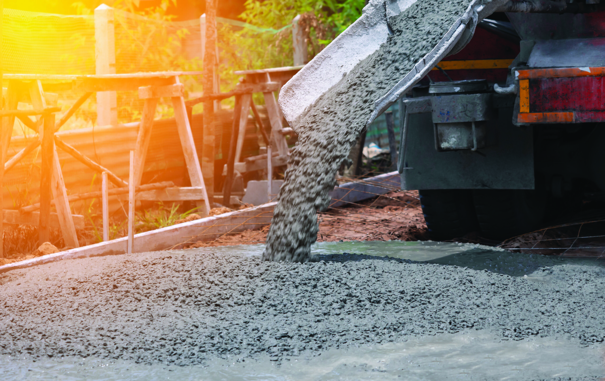 pouring a concrete mix at road construction site